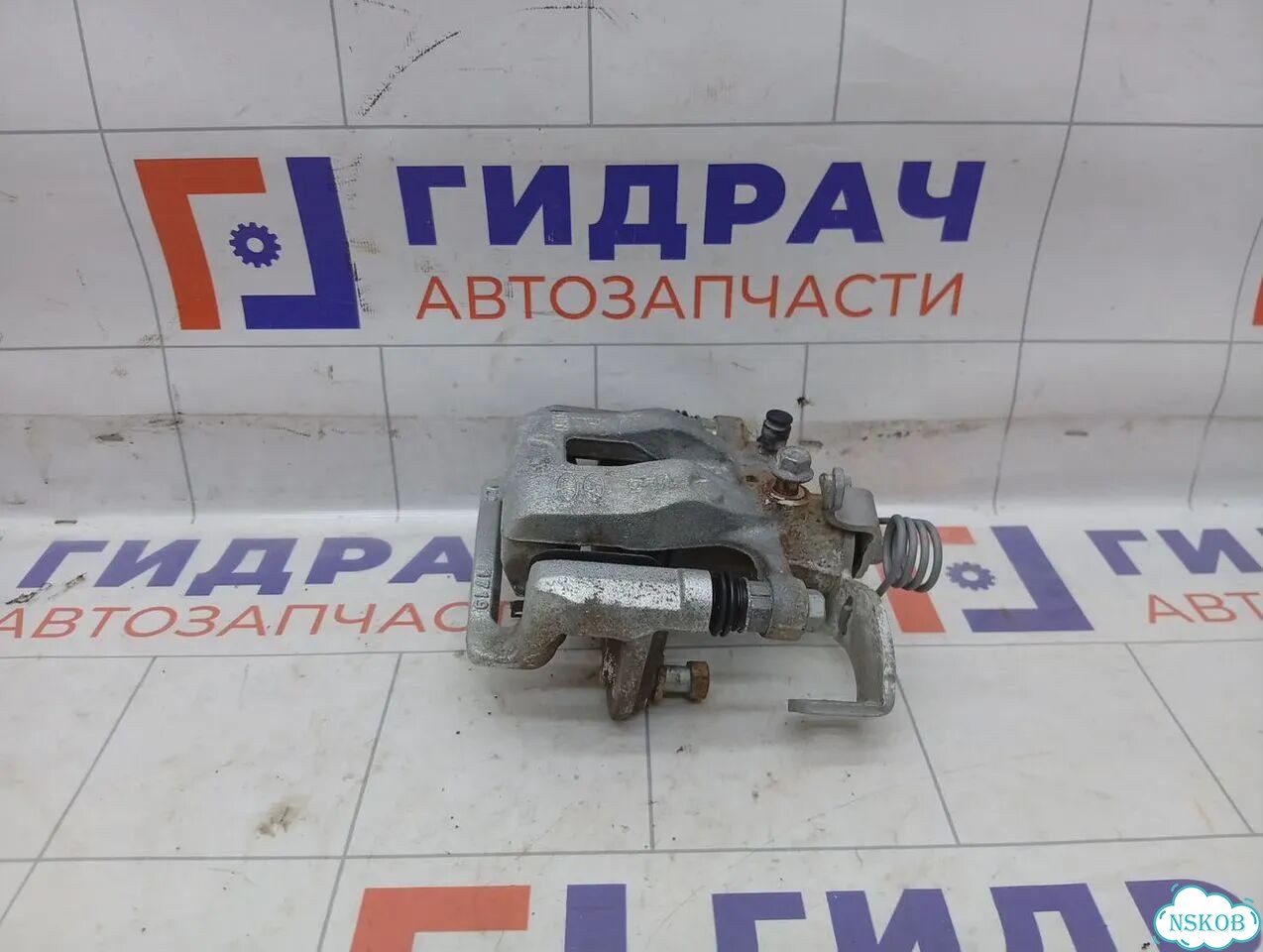 Суппорт тормозной (24 т.км.) задний левый Kia Rio X-line 58310H0A00 фото 1